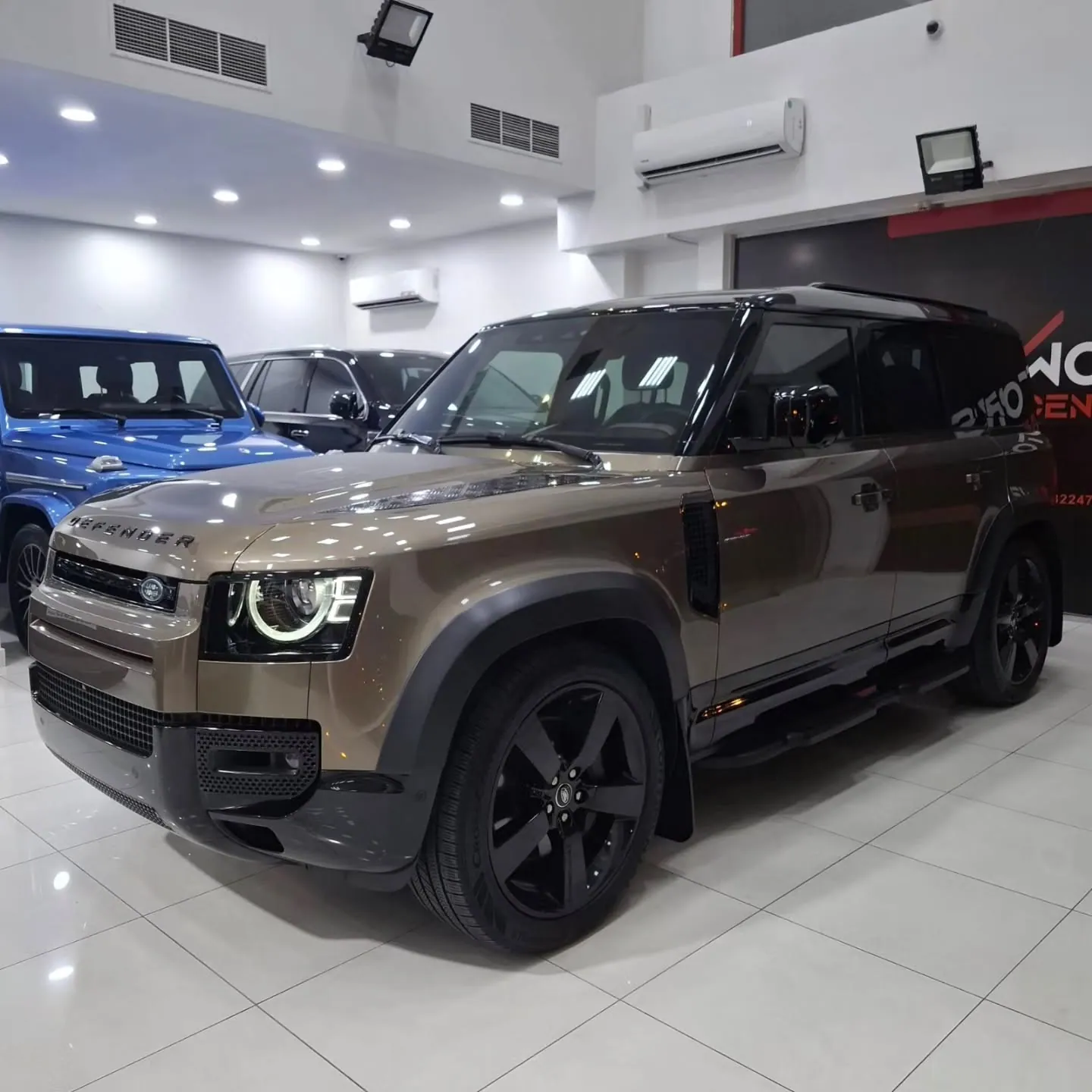 2025 Land Rover Defender 110 X-Dynamic HSE P400, front three-quarter view
